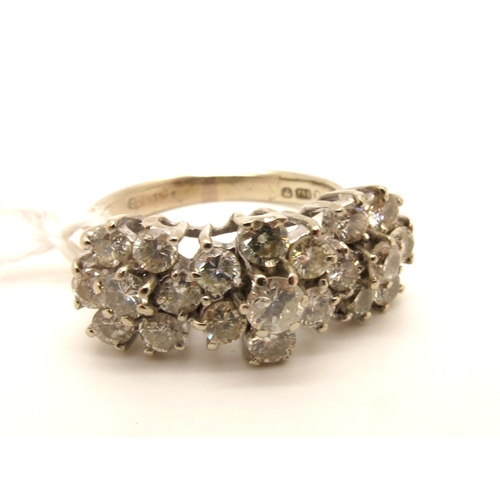 94 - A Diamond Set Triple Cluster Dress Ring, claw set throughout with brilliant cut diamonds, stamped 