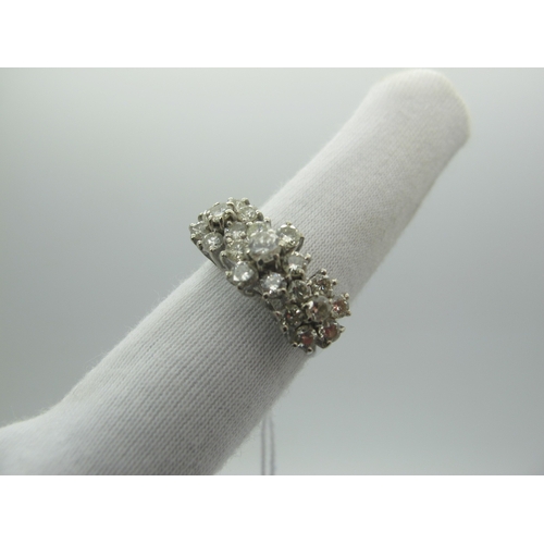 94 - A Diamond Set Triple Cluster Dress Ring, claw set throughout with brilliant cut diamonds, stamped 