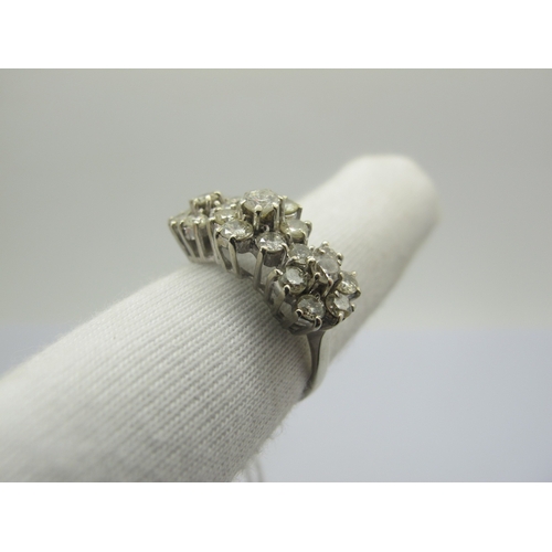 94 - A Diamond Set Triple Cluster Dress Ring, claw set throughout with brilliant cut diamonds, stamped 