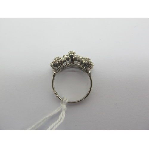 94 - A Diamond Set Triple Cluster Dress Ring, claw set throughout with brilliant cut diamonds, stamped 