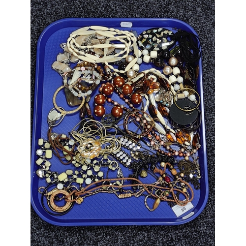 120 - An Assortment of Costume Jewellery, in hues of brown and gilt :- One Tray