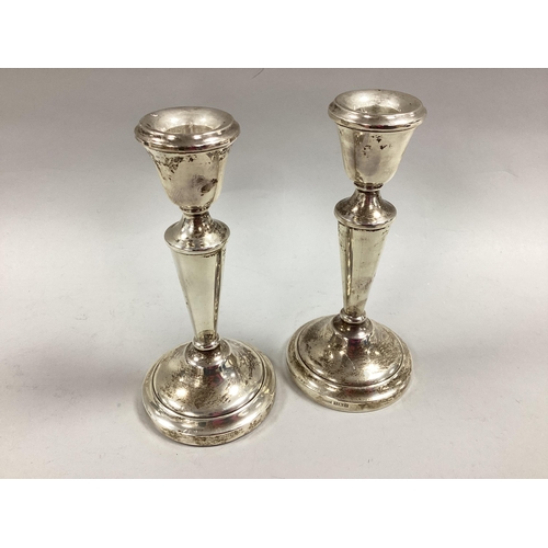 125 - A Pair of Hallmarked Silver Candlesticks, J.M-A, Birmingham 1972, 14.5cm high (bases weighted).