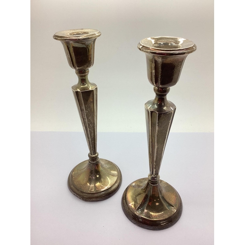 126 - A Matched Pair of Hallmarked Silver Candlesticks, (marks rubbed) (damage), 20.2cm high (bases weight... 