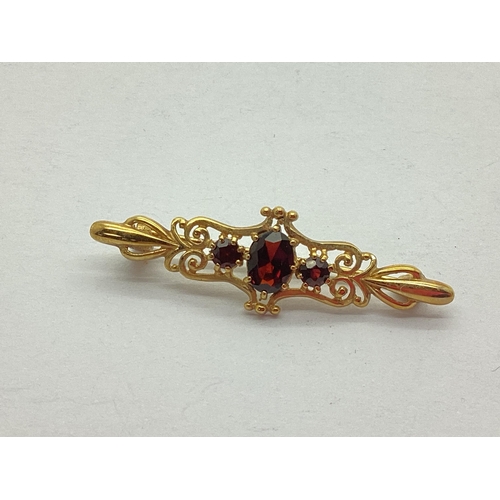 206 - A Modern 9ct Gold Bar Brooch, of antique style oval and circular claw set (pin stamped 