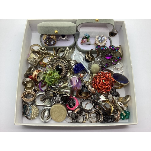 105 - A Large Collection of Assorted Costume Dress Rings, including two double ring boxes.