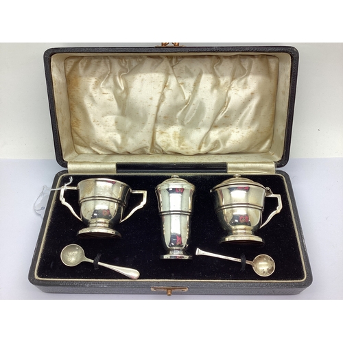 27 - A Hallmarked Silver Three Piece Cruet Set, Birmingham 1936, the lidded mustard and twin handled salt... 