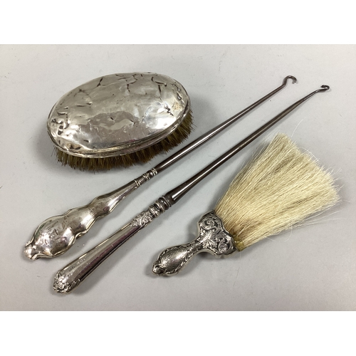 33 - A Hallmarked Silver Backed Brush, (dents / bristle loss); a decorative crumb brush, the handle stamp... 