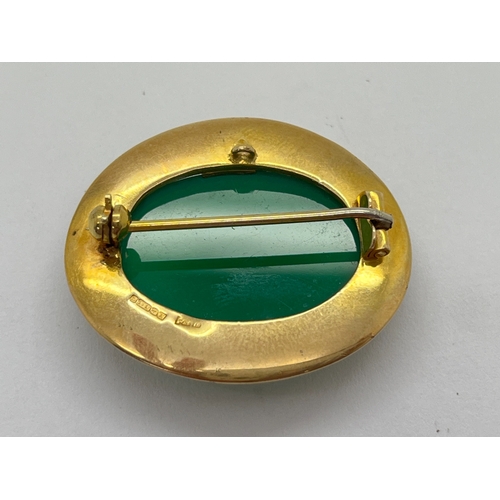 56 - A 9ct Gold Modernist Style Single Stone Brooch, cabochon collet set (small damage).