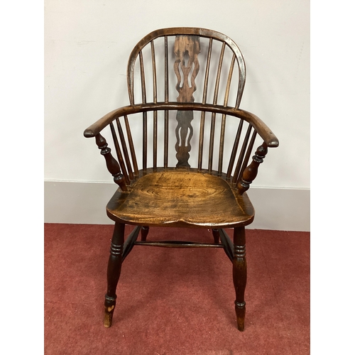 1523 - A XIX Century Ash and Elm Windsor Chair, with hooped back and pierced splats on turned legs united b... 
