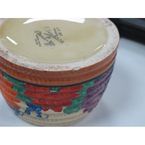 1047 - A Newport Pottery Clarice Cliff Honey Pot and Cover, painted in the 'May Day' pattern, printed marks... 