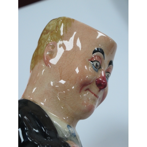 1056 - A Royal Doulton Pottery Toby Jug and Cover, 'George Robey' in Vaudeville make-up holding a cane, pri... 