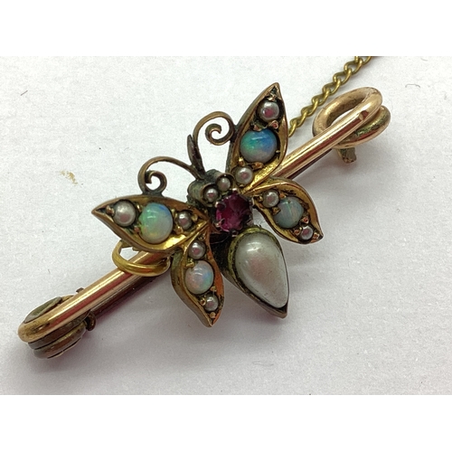 101 - An Antique Rolled Gold Opal, Garnet and Pearl Set Bar Brooch, of butterfly form, an antique hallmark... 