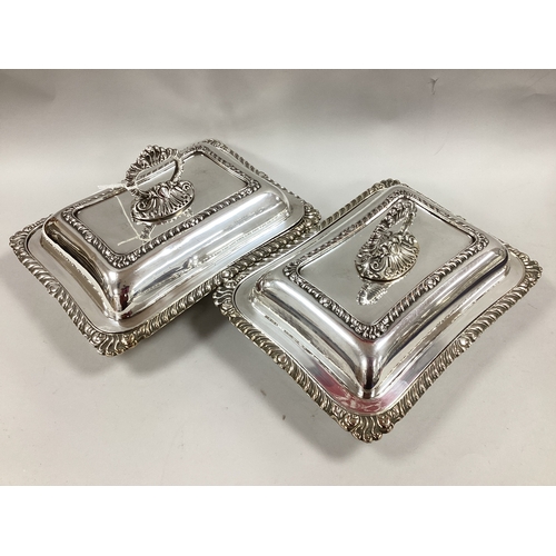 196 - A Pair of Rectangular Lidded Entree Dishes, with gadroned decoration and removable gadrooned loop ha... 