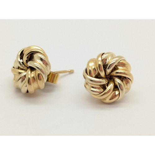 64 - A Pair of Two-Tone Knotted Earstuds, of twisted style.