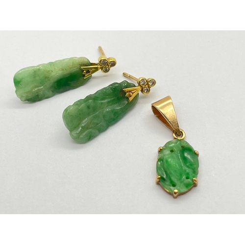 76 - A Pair of Carved Jade Drop Earrings, each with rubover set surmount; together with an oval panel pen... 