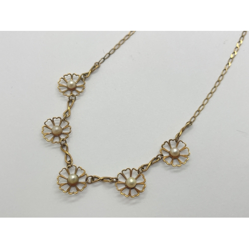 96 - A 9ct Gold Freshwater Pearl Necklace, of flowerhead drop design, infinity spacers to flat link chain... 