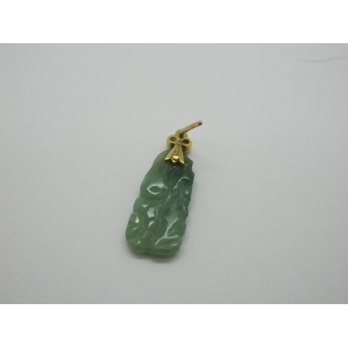 76 - A Pair of Carved Jade Drop Earrings, each with rubover set surmount; together with an oval panel pen... 