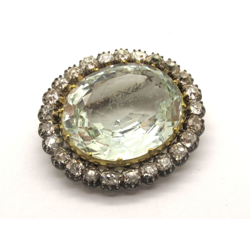 125 - An Antique Aquamarine and Diamond Set Brooch, oval claw set within border of old cut diamonds, 2.9cm... 