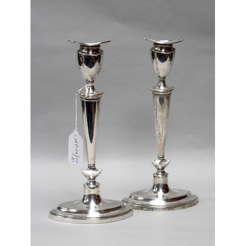 16 - A Pair of Hallmarked Silver Candlesticks, Hawksworth Eyre & Co Ltd, Sheffield 1917, each of plain ta... 