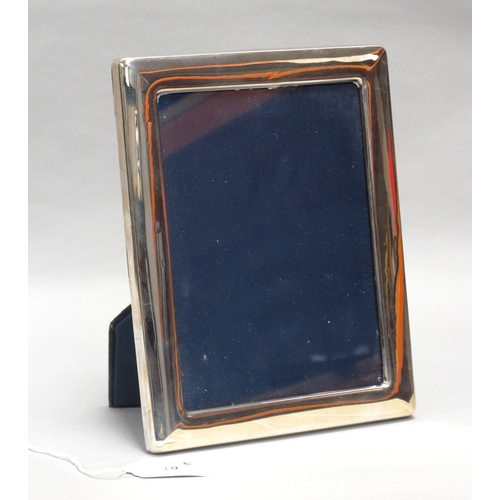 19 - A Modern Hallmarked Silver Mounted Rectangular Photograph Frame, HH, Sheffield 1991, on dark blue pl... 