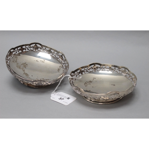 37 - A Pair of Hallmarked Silver Dishes, P Brs, Sheffield 1943, each of circular form with foliate scroll... 