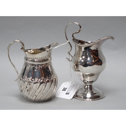 38 - A Georgian Hallmarked Silver Cream Jug, (marks rubbed) with beaded edge and high scroll loop handle,... 