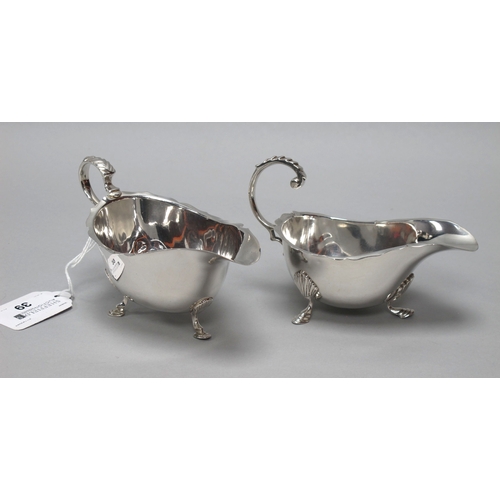 39 - A Hallmarked Silver Sauce Boat, Walker & Hall, Birmingham 1966, with wavy cut edge and leaf capped s... 