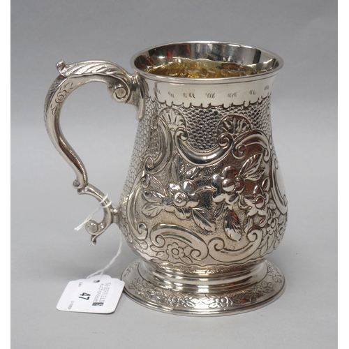 47 - A Heavy Georgian Hallmarked Silver Mug, (marks rubbed) London 1756, of baluster form, allover profus... 