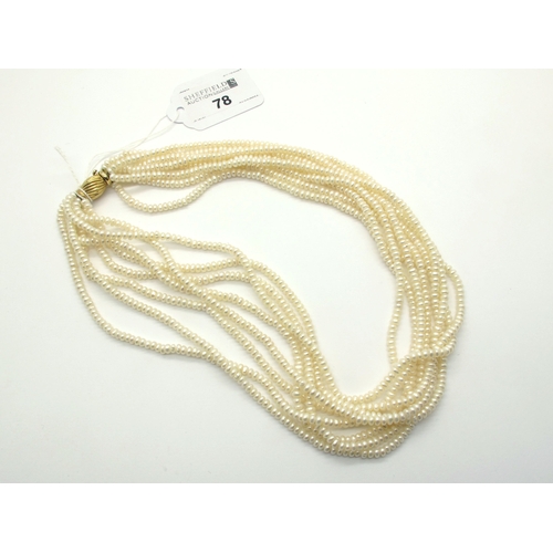 78 - A Modern Multi Strand Fresh Water Pearl Bead Necklace, of uniform design to textured clasp stamped 