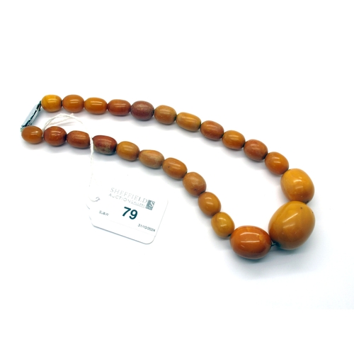 79 - A Graduated Single Strand Amber Colour Bead Necklace, (in need of restringing) approximately 44cm lo... 