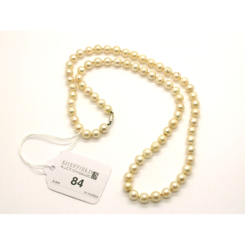 84 - A Single Strand Pearl Bead Necklace, of uniform design, knotted to clasp stamped 