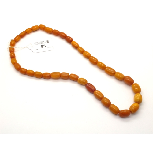 85 - A Graduated Single Strand Amber Colour Bead Necklace, (strung with no clasp), approximately 60cm lon... 