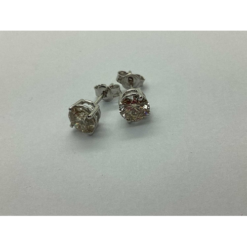 70 - A Pair of Modern 18ct White Gold Single Stone Diamond Earstuds, each brilliant cut stone four claw s... 