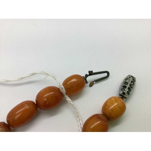 79 - A Graduated Single Strand Amber Colour Bead Necklace, (in need of restringing) approximately 44cm lo... 