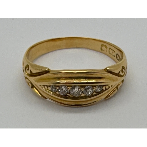 101 - An Antique Five Stone Diamond Ring, of boat form, the graduated brilliant cut stones between decorat... 