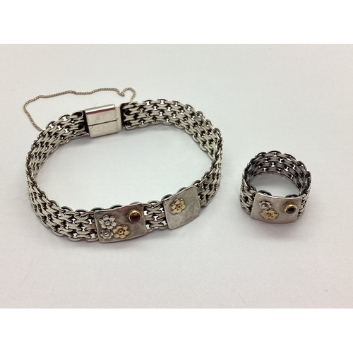 140 - Talma; A Fancy Link Bracelet, the articulated style bracelet with applied panels of hammered texture... 