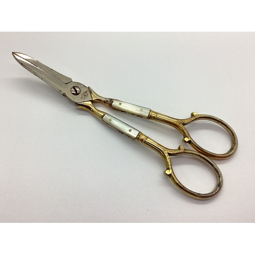 38 - A Pair of Vintage Gilted Ed Wusthof Mother of Pearl Handled Grape Scissors, scrolling decorative rin... 