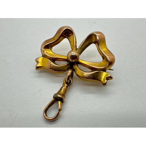 42 - An Antique Bow Brooch Pocket Watch Suspender, the bow of sinuous design with beaded centre, suspendi... 