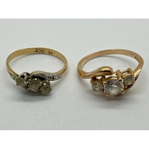 75 - A Three Stone Diamond Crossover Ring, the uniform band stamped 