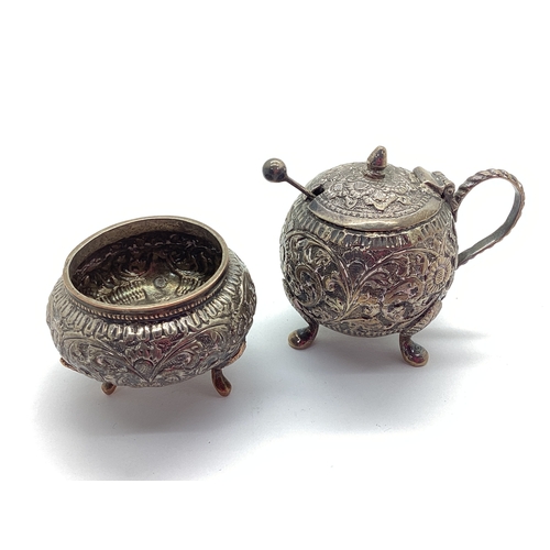 8 - A Highly Decorative XX Century Condiment Set, allover cutch decorated in relief, the mustard pot wit... 