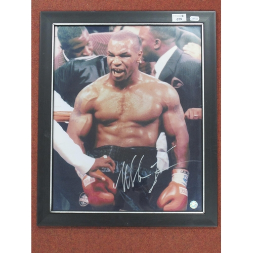 629 - Boxing - Mike Tyson Autograph, silver pen signed (unverified) on an image of him, framed, overall 58... 