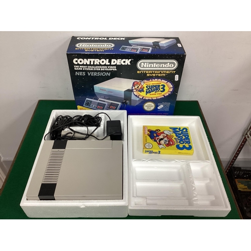 722 - A Nintendo Entertainment System - NES Control Deck, with Super Mario Bros 3 game pak, two hand contr... 