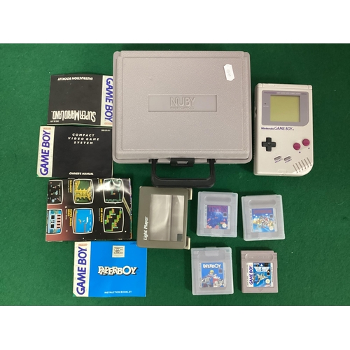 723 - A Nintendo Game Boy Hand Held Gaming Console, S/N G18942466, Owners Manual, Four Games Cartridges in... 