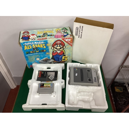 725 - A Super Nintendo Entertainment System (SNES), Super Mario All Stars plus Mario World Edition. compri... 