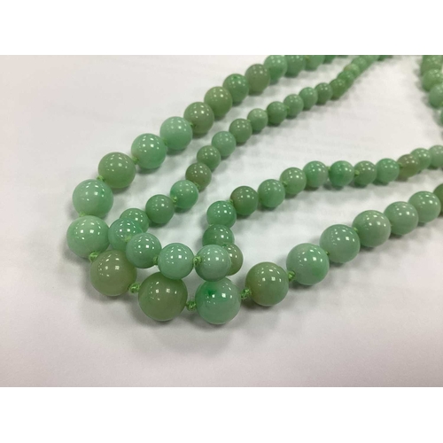 144 - JKa Kohle of Pforzheim; A Jade Bead Multi-row Necklace, the graduated beads knotted to fancy clasp s... 