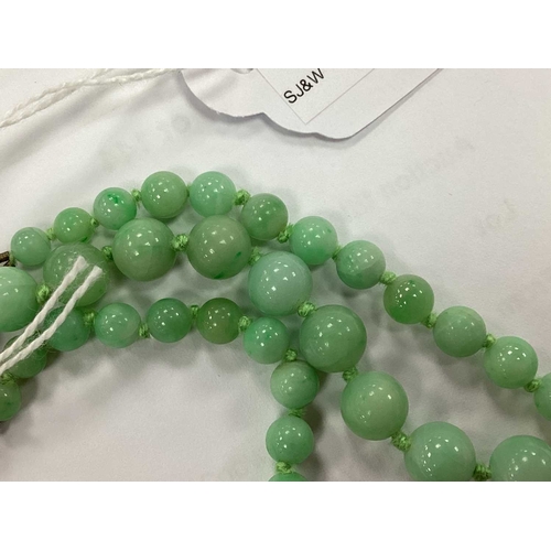 144 - JKa Kohle of Pforzheim; A Jade Bead Multi-row Necklace, the graduated beads knotted to fancy clasp s... 