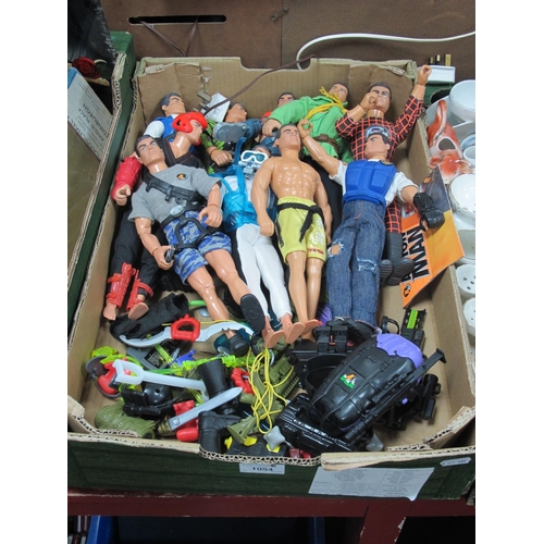 1054 - Action Man figures, ten in various outfits, together with various accessories, including guns, back ... 