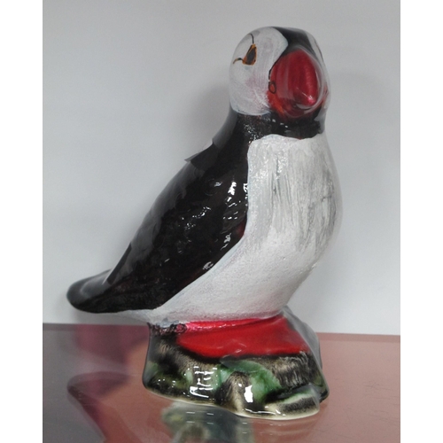 1216 - Anita Harris Model of a Puffin in reactive glazes and enamels, gold signed, 14cm high.