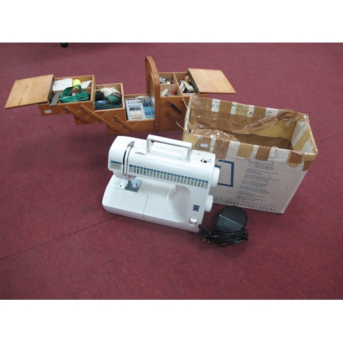 1385 - Toyota sewing machine together with a wooden sewing box containing relevant accessories. (2)