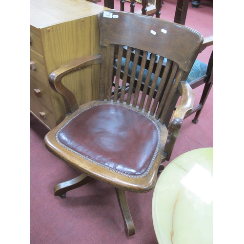 1522 - 1920's Oak Office Swivel Chair, with slatted back, studded seat on cruciform base.